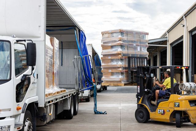 Forklift loading pallets onto an All Freight Carrying curtainsider